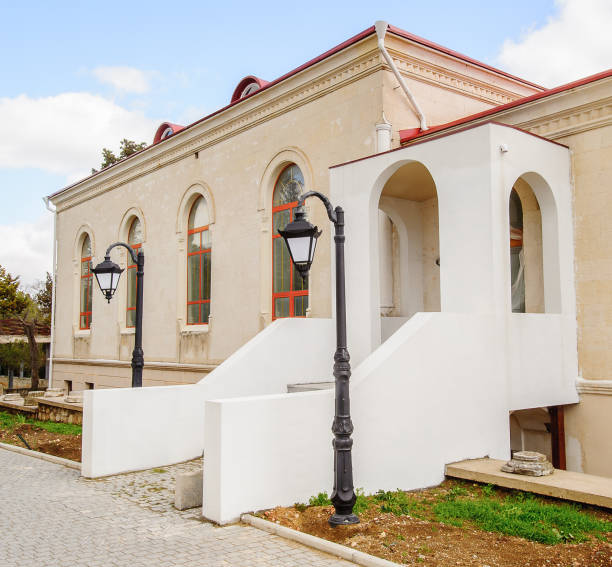 istock House with white porch in front of blue sky 822895016