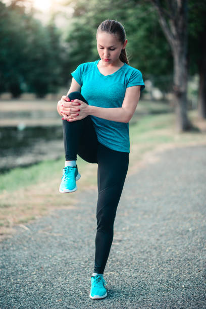 istock Young Fitness Woman Runner Stretching Legs Before Jogging 822909672