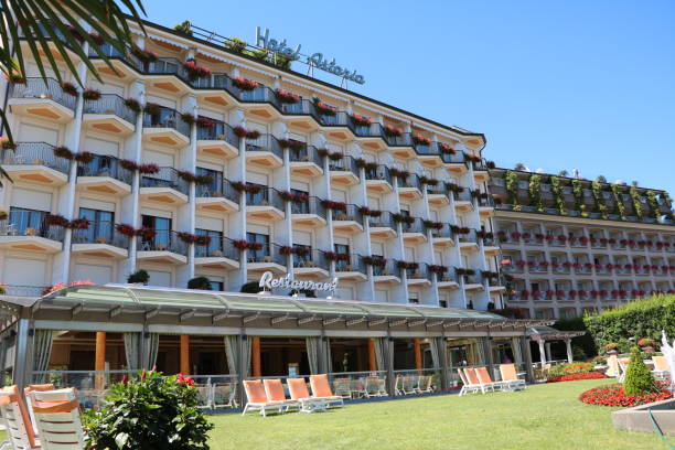 Hotel Astoria  and Hotel La Palma in Stresa in front of the Borromean Islands at Lake Maggiore, Piedmont Italy Hotel Astoria  and Hotel La Palma in Stresa in front of the Borromean Islands at Lake Maggiore in summer. Piedmont in Italy 1908 stock pictures, royalty-free photos & images