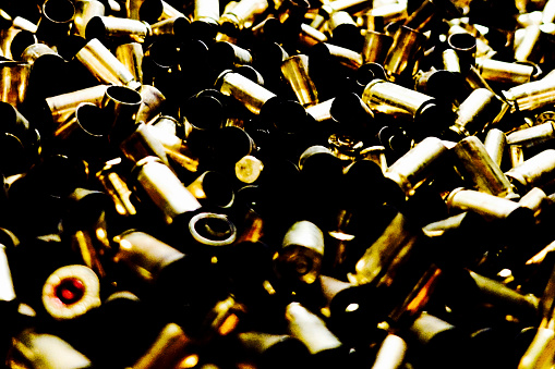 used bullet cases in a bucket