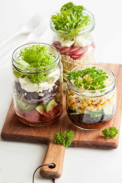 istock healthy vegetable cheese salad in mason jars 822928876