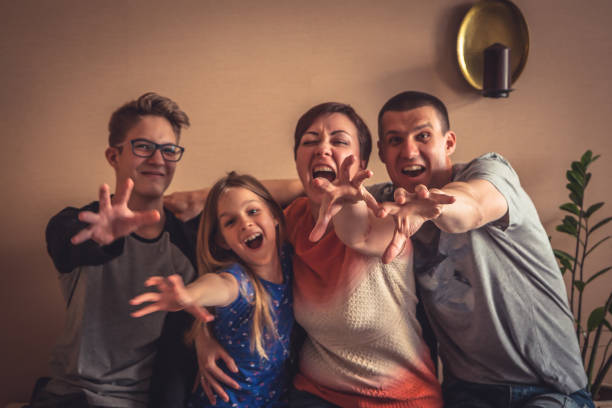 istock Give it to me family with pulling hands looking at camera 822930226