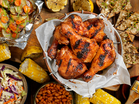 BBQ Chicken Feast with Corn on the Cob, Baked Beans, Coleslaw, Potatoes, Carrots and Grilled Bread