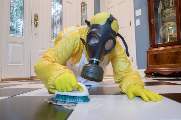 Mature woman in Haz Mat suit scrubbing floor Mature woman in yellow Haz Mat suir and gas mask on floor scrubbing black and white tiles. gas mask latex women female stock pictures, royalty-free photos & images