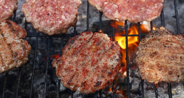 istock Meat burgers for hamburger grilled on flame grill 822949020