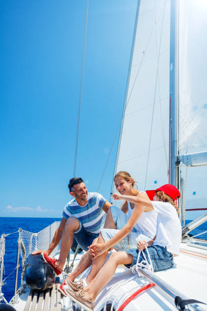 istock Father with adorable kids resting on yacht 822960034