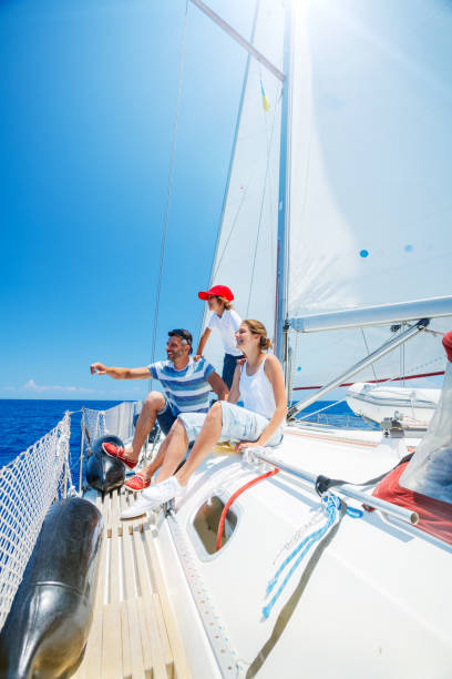 istock Father with adorable kids resting on yacht 822960162