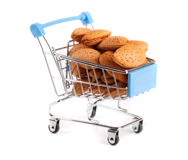 istock Shopping cart with almonds isolated on white background 822964754