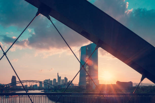 The new European Central Bank building during sunset seen from the Osthafen Bridge