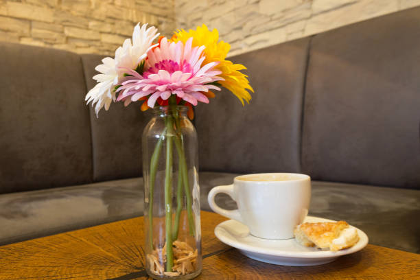 istock Gerbera in a glass vase on a rustic wooden block 822966884
