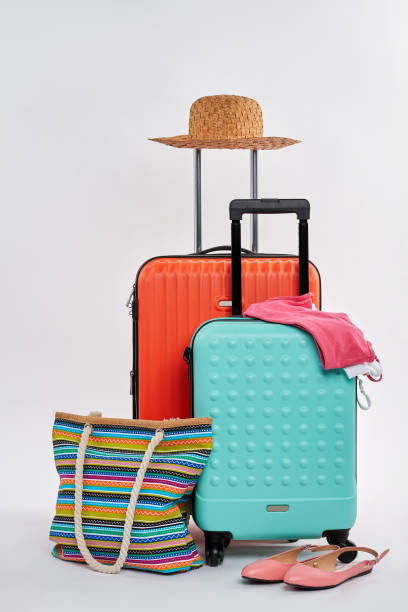 istock Straw hat, woman accessories, suitcases. 822969140