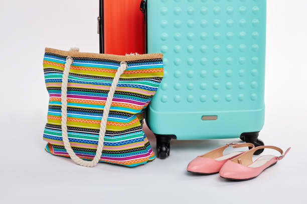 istock Pair of suitcases, handbag, sandals. 822969954