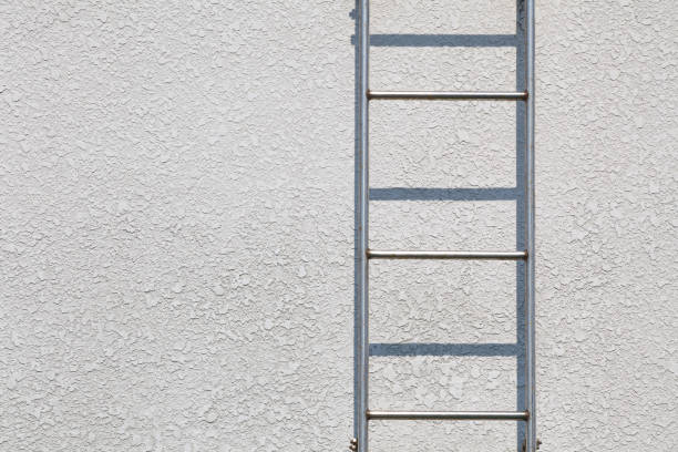 istock Close - up Metal Fire escape and concrete wall background 823018298