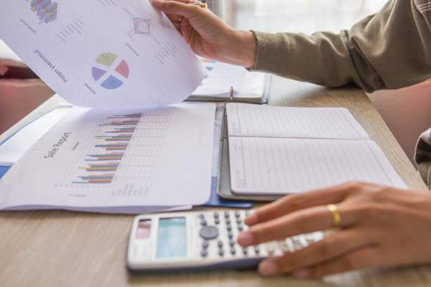 istock People check profit fund graph about cost at home 823026700