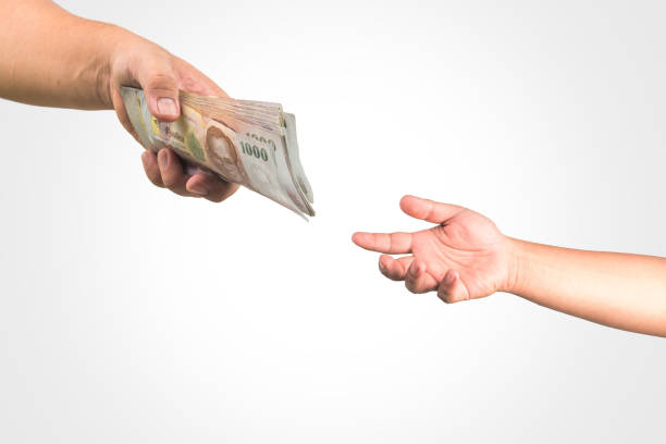 istock The Thailand money in hand ,isolate 823045492