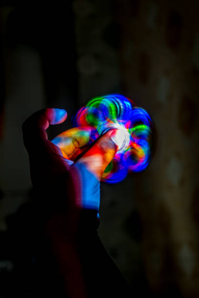 istock Child holding spinning fidget spinner in hand 823059032