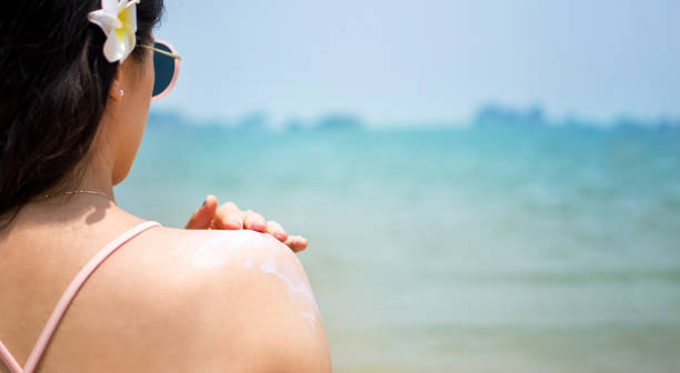 istock Girl applying sun lotion on summer vacation 823073488