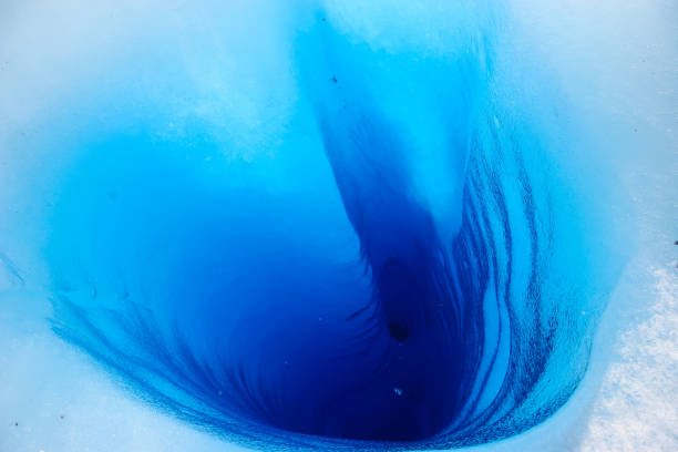 istock A brilliant blue sink hole appears in a glacier 823075584