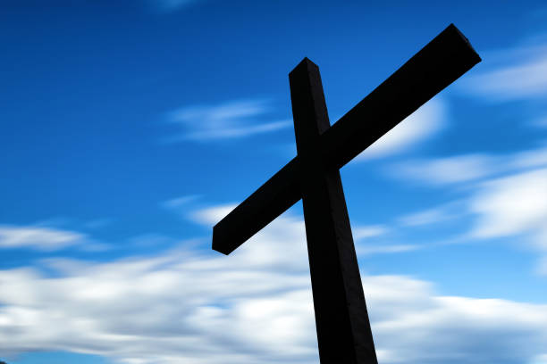 istock Cross silhouette and the clouds 823076774