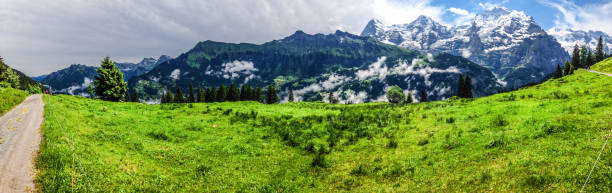 istock Spectacular panoramic view of Eiger, Monch, Jungfrau mountains from Murren-Gimmelwald trail, Swiss alps, Bernese Oberland, Berne Canton, Switzerland, Europe. Great outdoor trail, best scenery for family activities, start from Lauterbrunnen station. 823081180