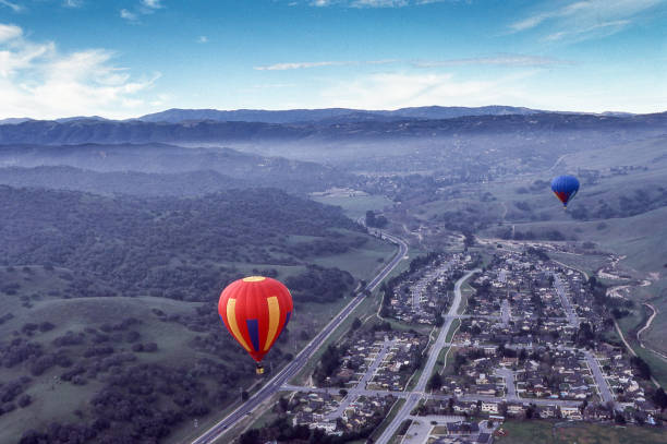 istock Two Hot Air Balloons in Flight Through Carmel Valley 823086786