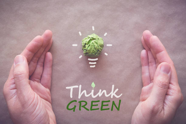 istock Green paper light bulb with Think Green, eco energy saving concept 823102242