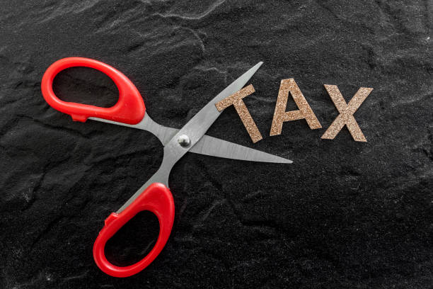 istock Scissors and the alphabet TAXES 823104412