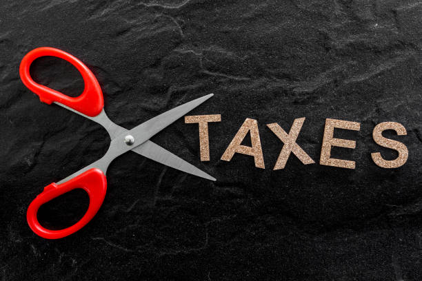 istock Scissors and the alphabet TAXES 823104596
