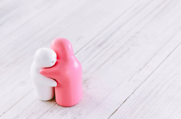 istock White and pink ceramic doll on wood 823111028