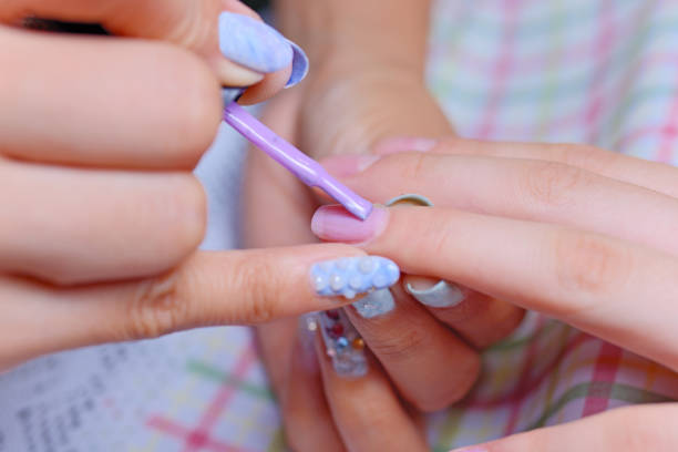 istock Manicurist Applying Nail Varnish 823119178