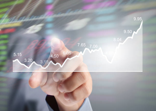 istock businessman with financial symbols coming from hand 823127434