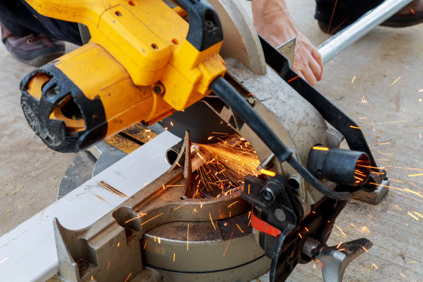istock Close-up of worker cutting metal with grinder. Sparks while grinding iron. Low depth focus 823172564