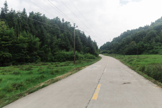 istock concrete rural road in the sunny day 823179966
