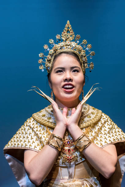 istock Young Thai woman performing in traditional costume. 823206492