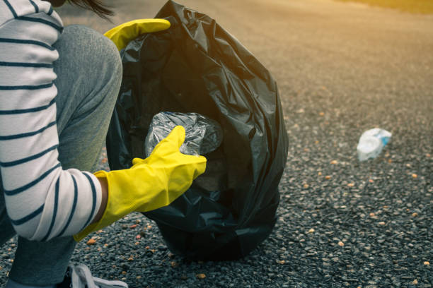 istock Group of kids volunteer help garbage collection charity environment. 823206716