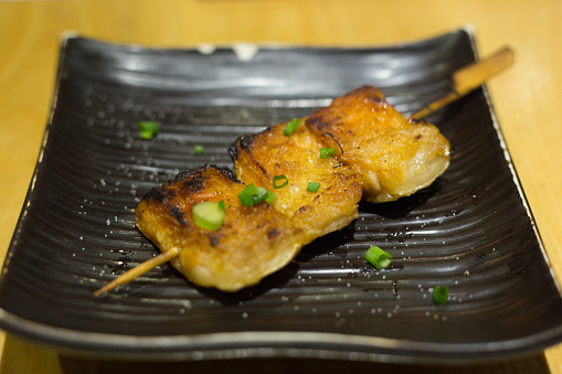 Sushi Belly Salmon Grilled on a black plate,Japanese Food