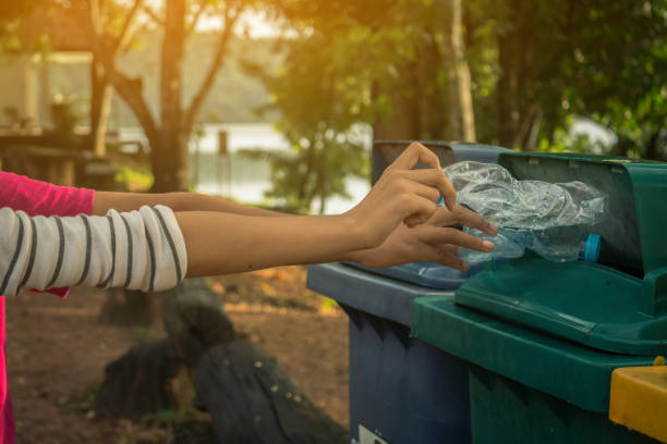 istock Group of kids volunteer help garbage collection charity environment. 823207682