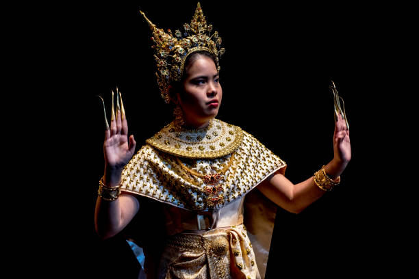 istock Young Thai woman performing classical dance in traditional costume. 823208124