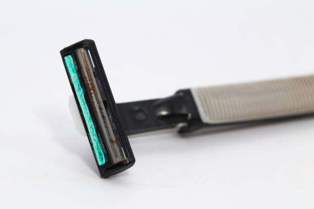 istock Used grungy rusty shaving razor on a white background 823222328