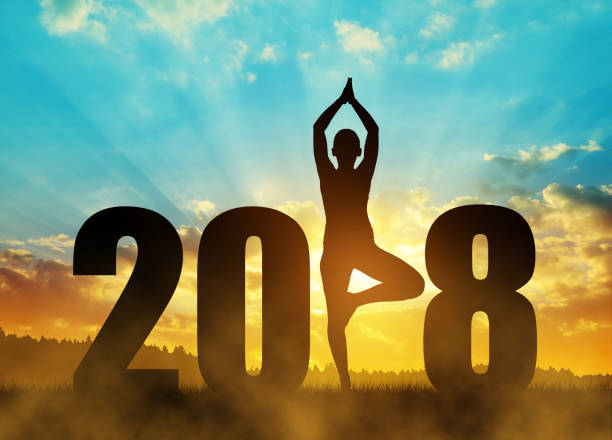 istock Girl practicing yoga in the New Year 2018. 823236616