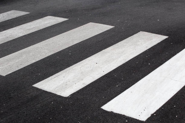 istock Crosswalk on black asphalt road. 823239368