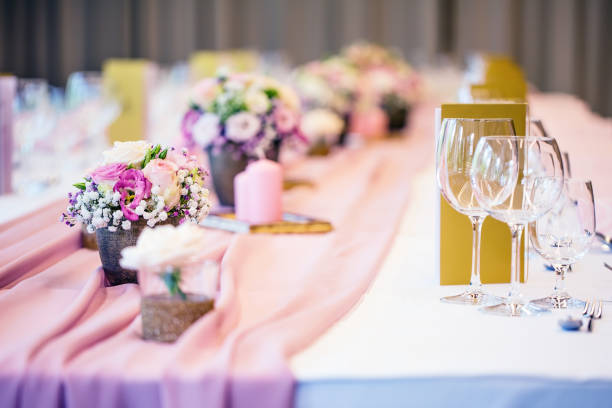istock Wedding table setting. Beautiful table set with flowers and glass cups  for some festive event, party or wedding reception 823239454