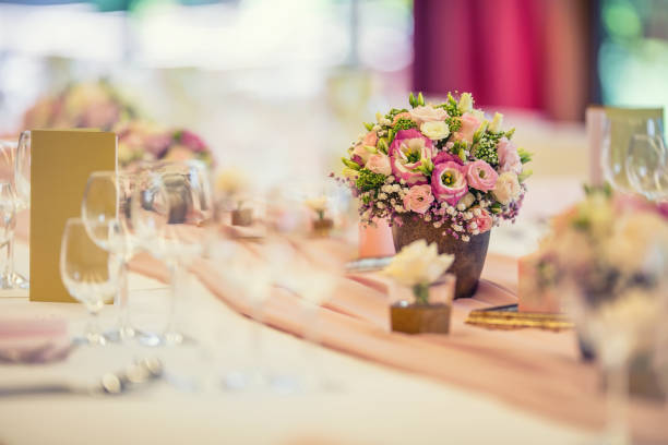 istock Wedding table setting. Beautiful table set with flowers and glass cups  for some festive event, party or wedding reception 823239474