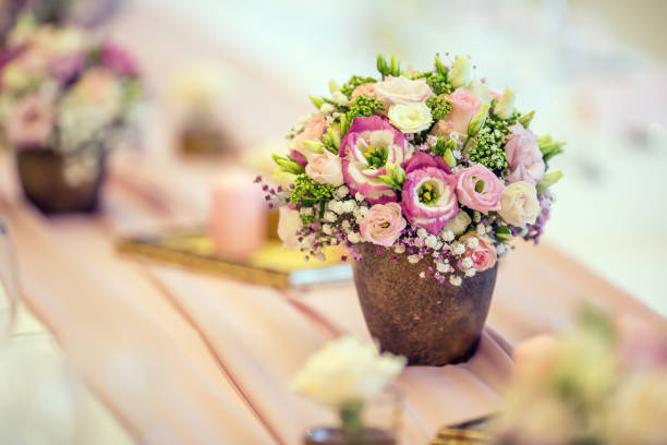 istock Wedding table setting. Beautiful table set with flowers and glass cups  for some festive event, party or wedding reception 823239488