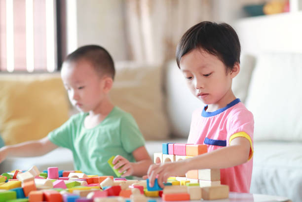 istock Cute asian Children playing with blocks 823244802