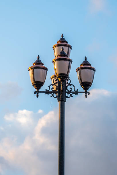istock The old retro lamp post and the beautiful white and blue sky 823247560