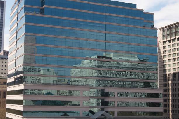 istock building reflecting buildings with others around it 823248064