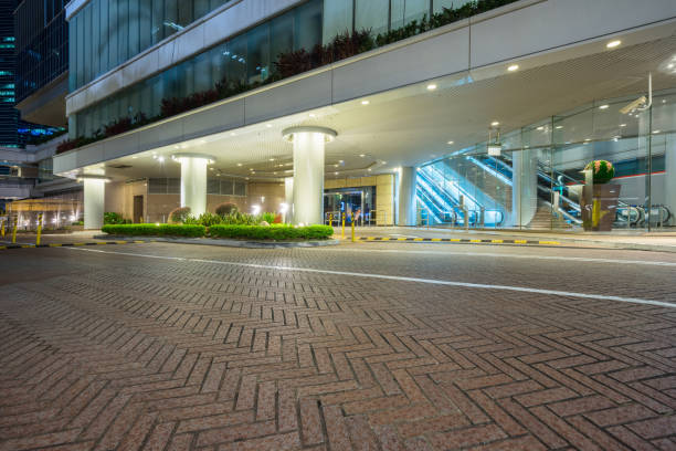 istock square front of modern office buildings at night 823248128