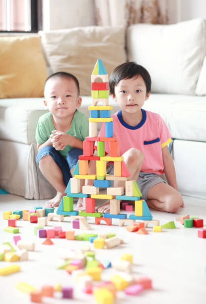 istock Cute asian Children playing with blocks 823248416