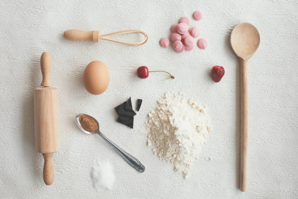 Kitchen utensils and food on white background - knolling